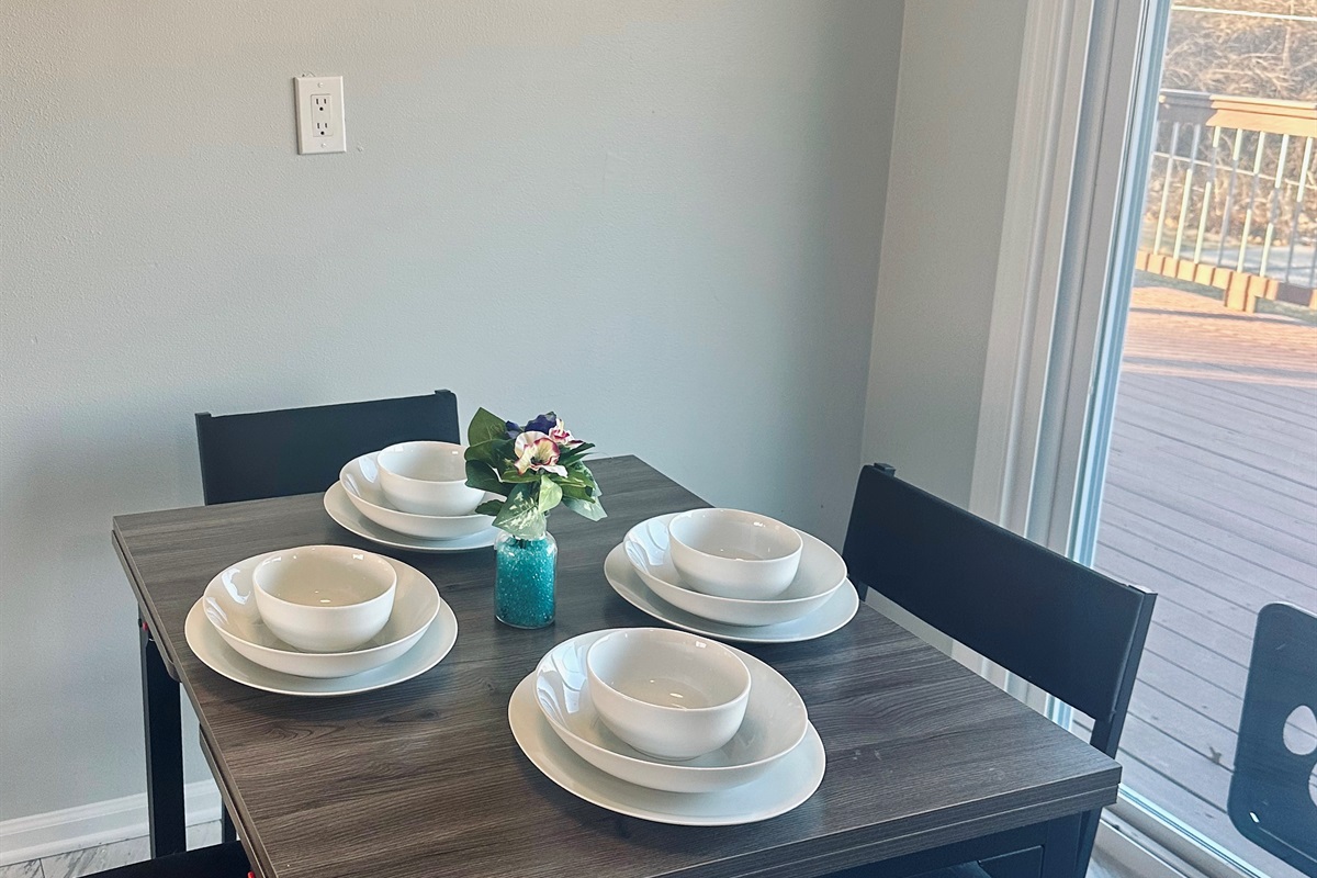 This expanding dining table set for everyday, space-saving, use in it’s compact form, seating four with full place settings.