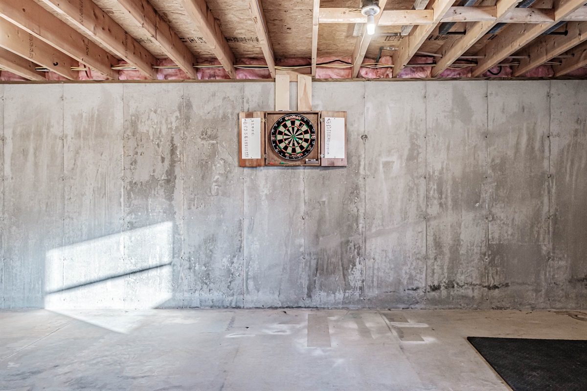 The basement game area is stocked with ping pong and darts for nonstop fun.
