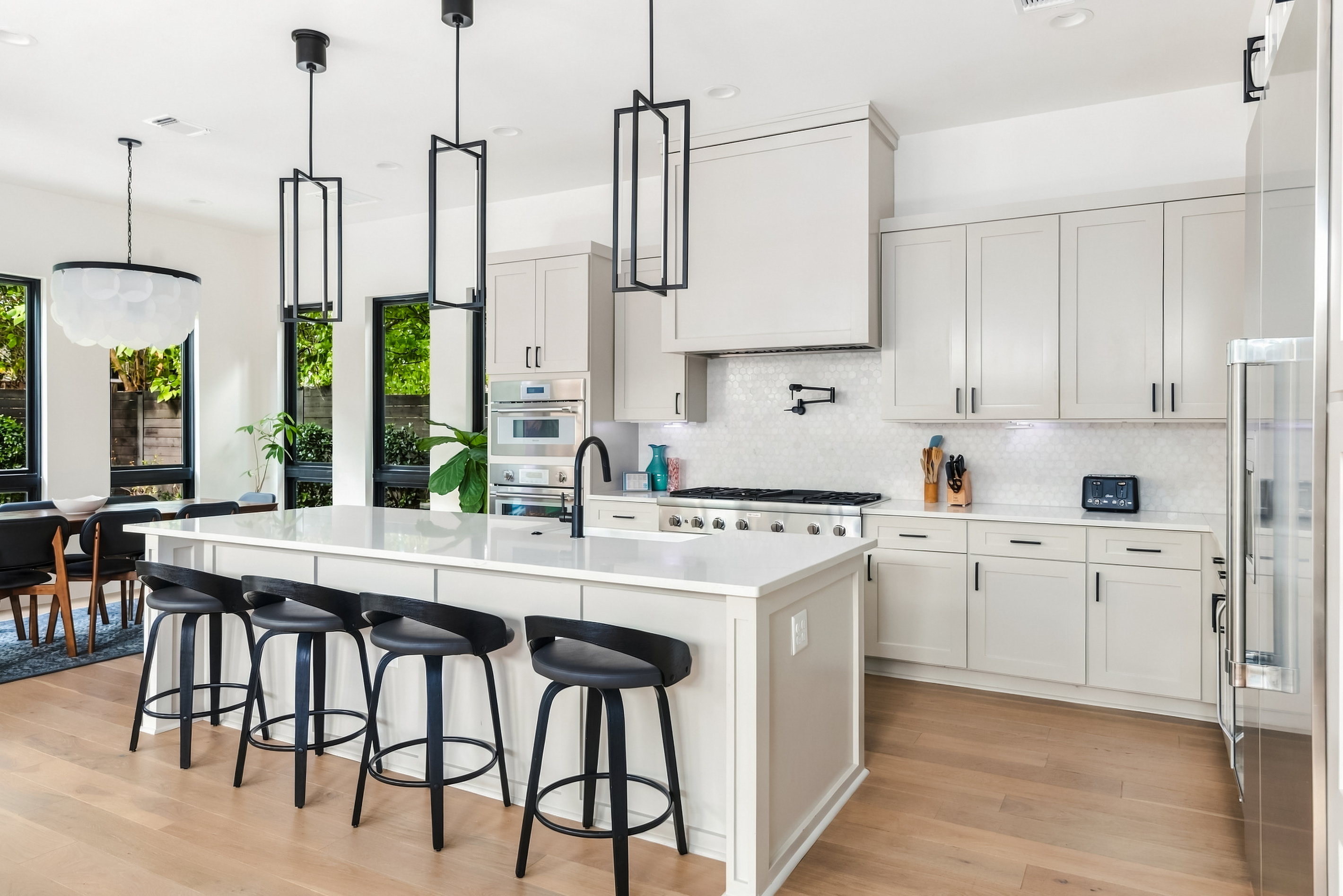 Large island with bar seating — the heart of this modern East Austin kitchen.