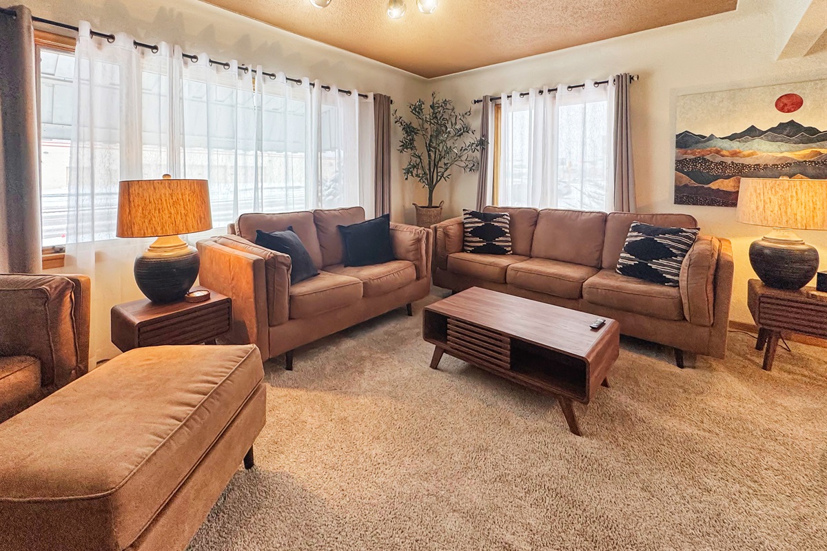Gather here: 75" TV and plush seating for the perfect movie night