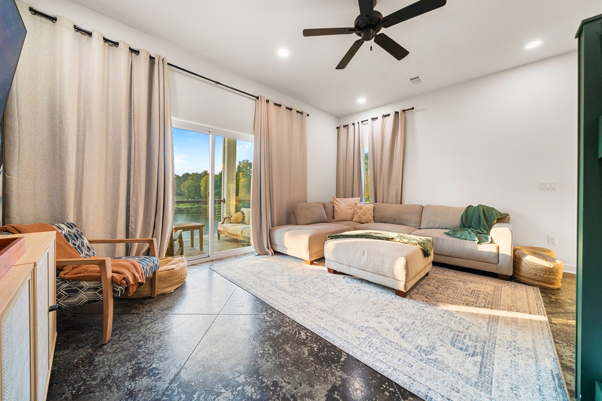 Bright lower-level living space opening to the patio, ideal for relaxation after a day on the lake.