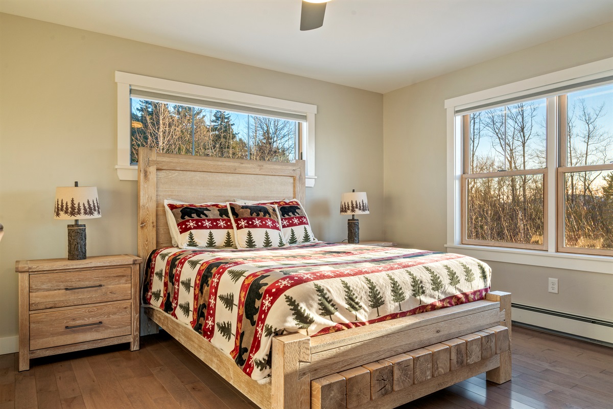 Relax in a queen bedroom with a table and chair workspace