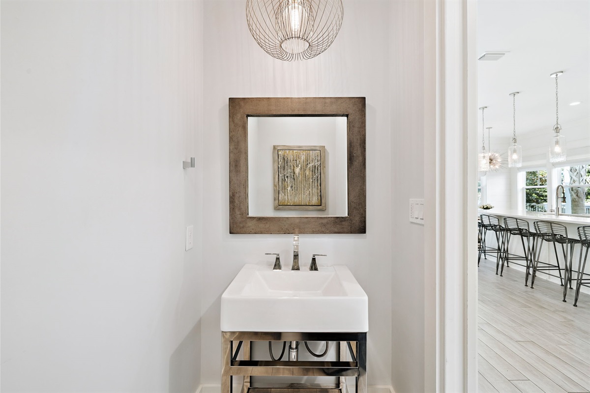 First- floor half bathroom located just off the kitchen