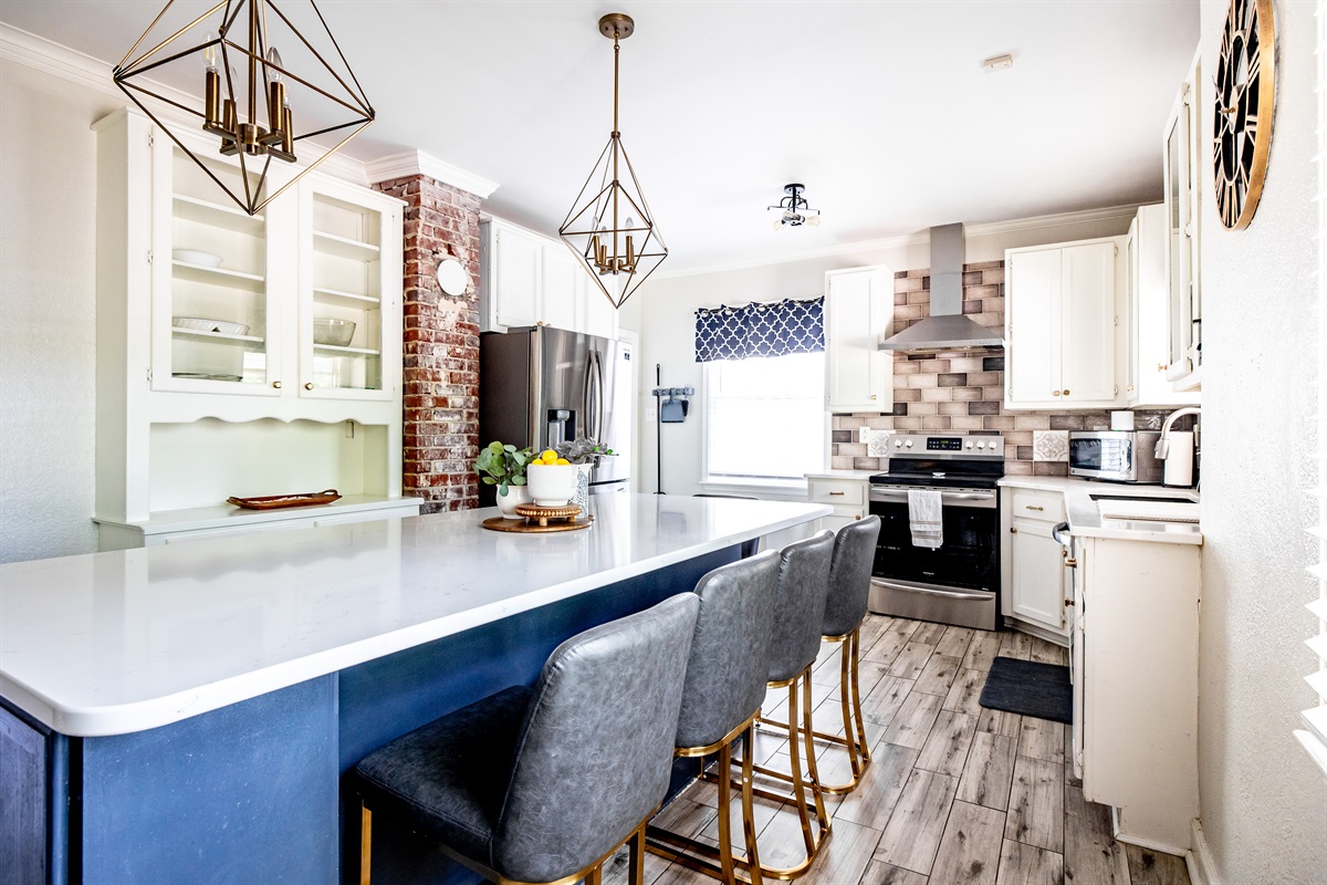 Kitchen with island and barstools