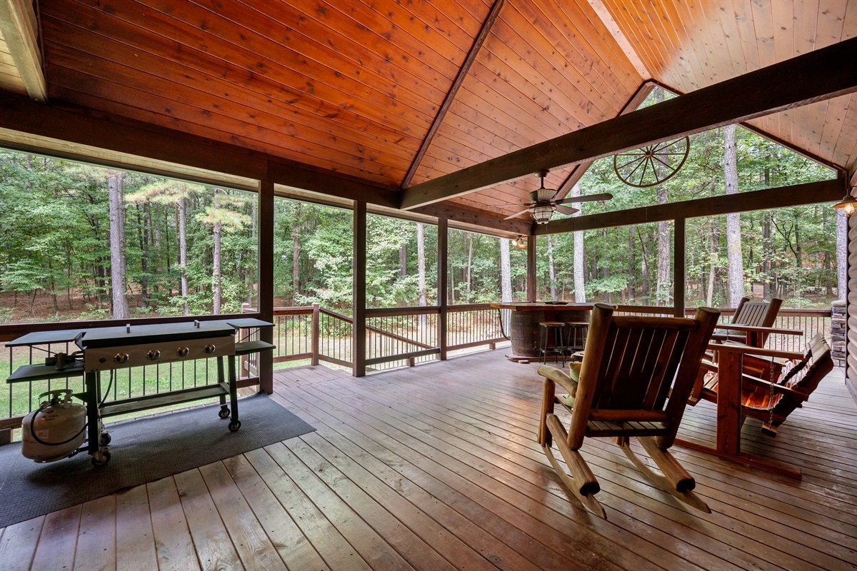 The covered back deck is perfect for morning or evenings.  Seating has 2 rocking chairs and bench glider with cooler.