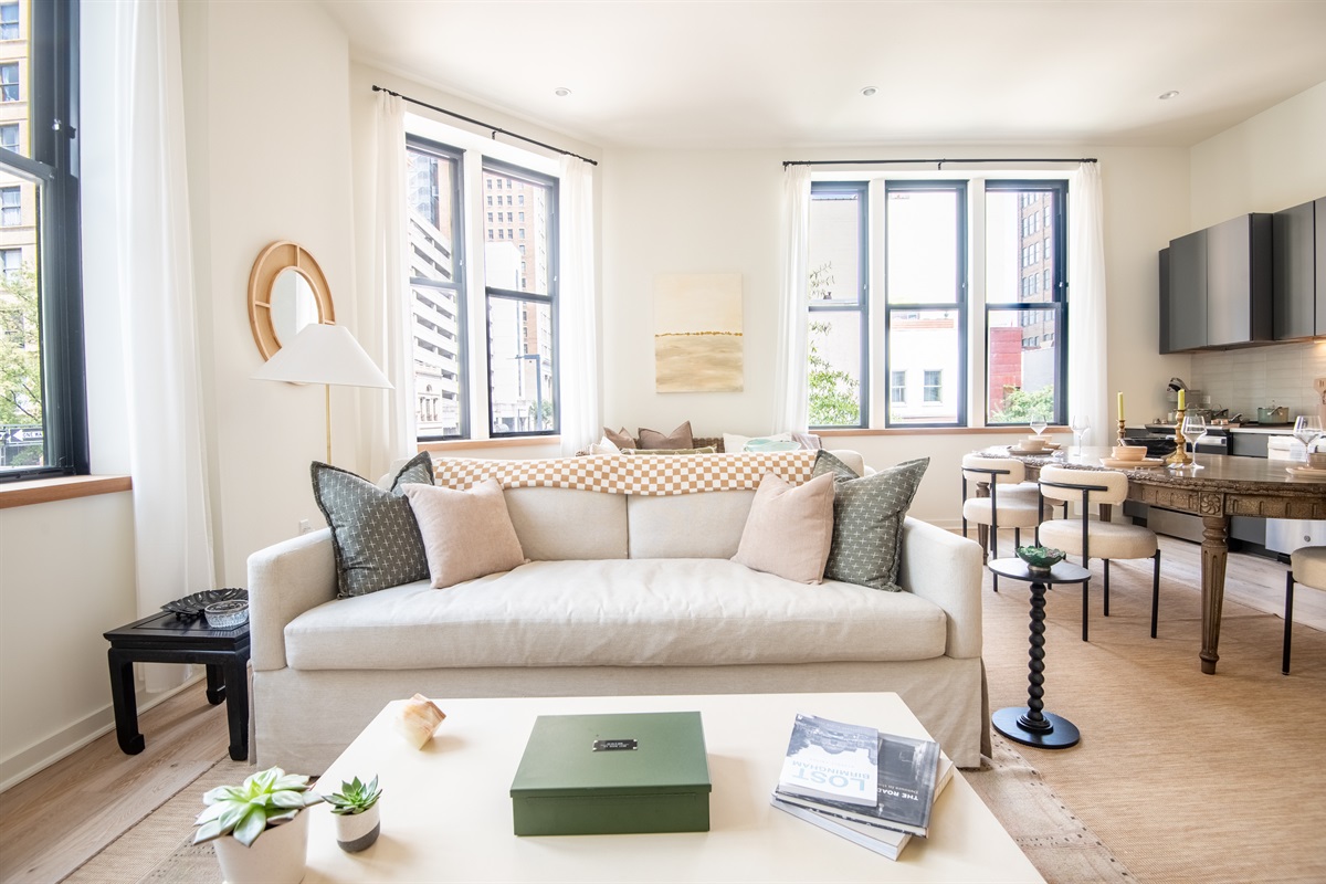 Spacious lounge area with plush sofas and bright natural light