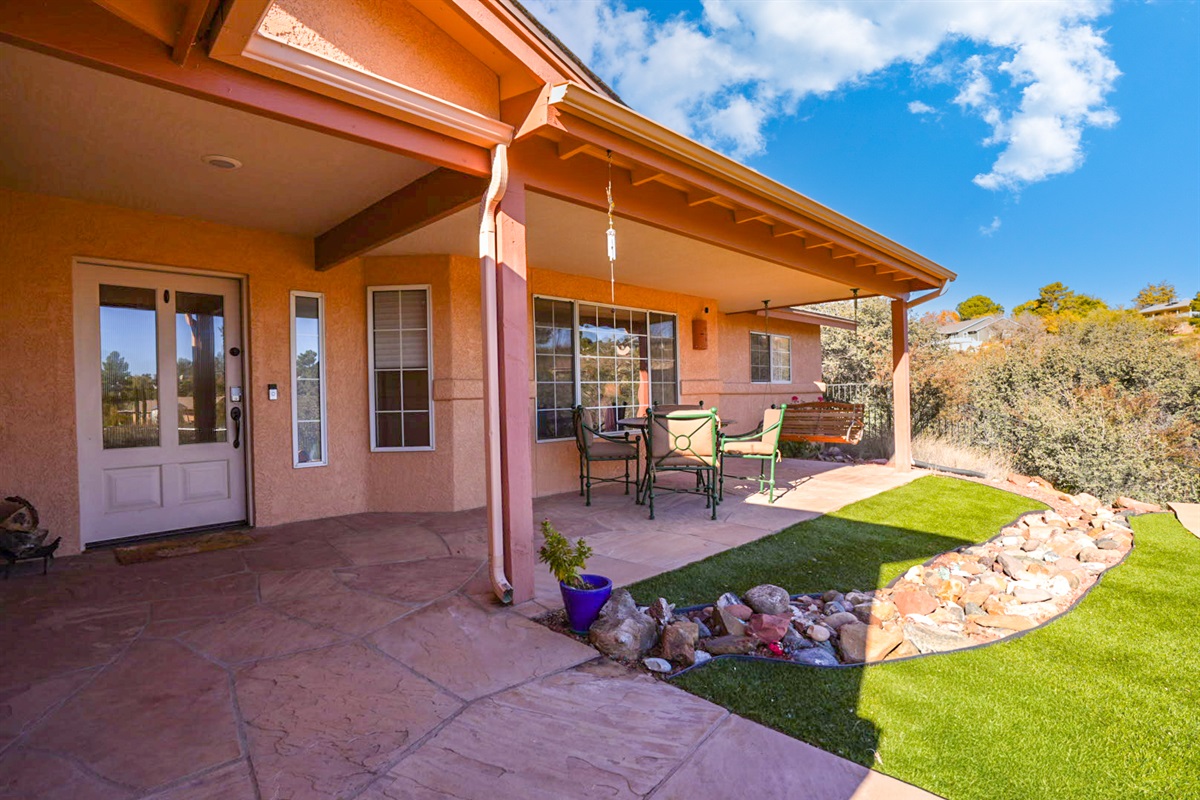 Quiet covered patio with comfortable seating—perfect for morning coffee, reading, or winding down in the shade.