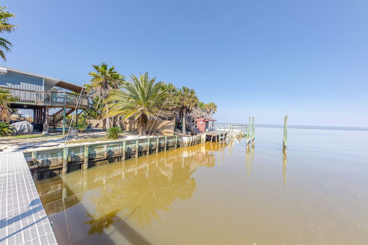 Outdoor Paradise: Relax by the water with palm trees and endless bay views from your deck!