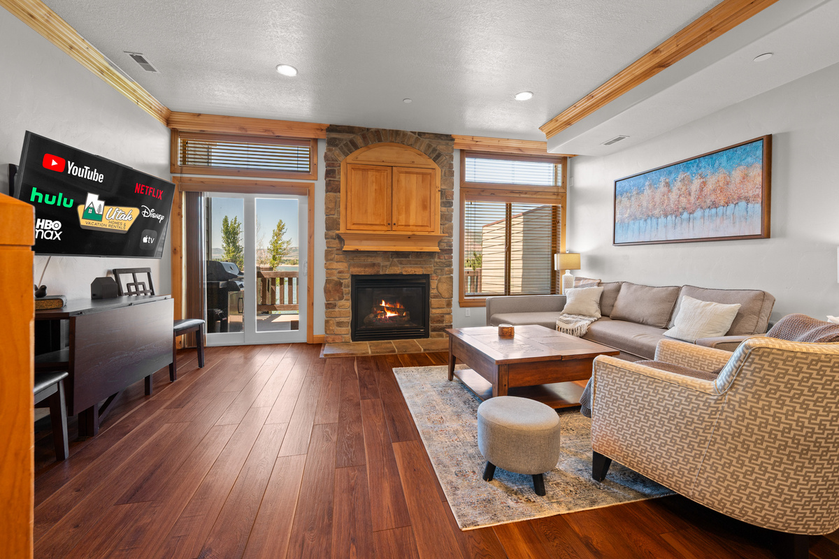 Bright and inviting living room with lake views and easy access to the deck.