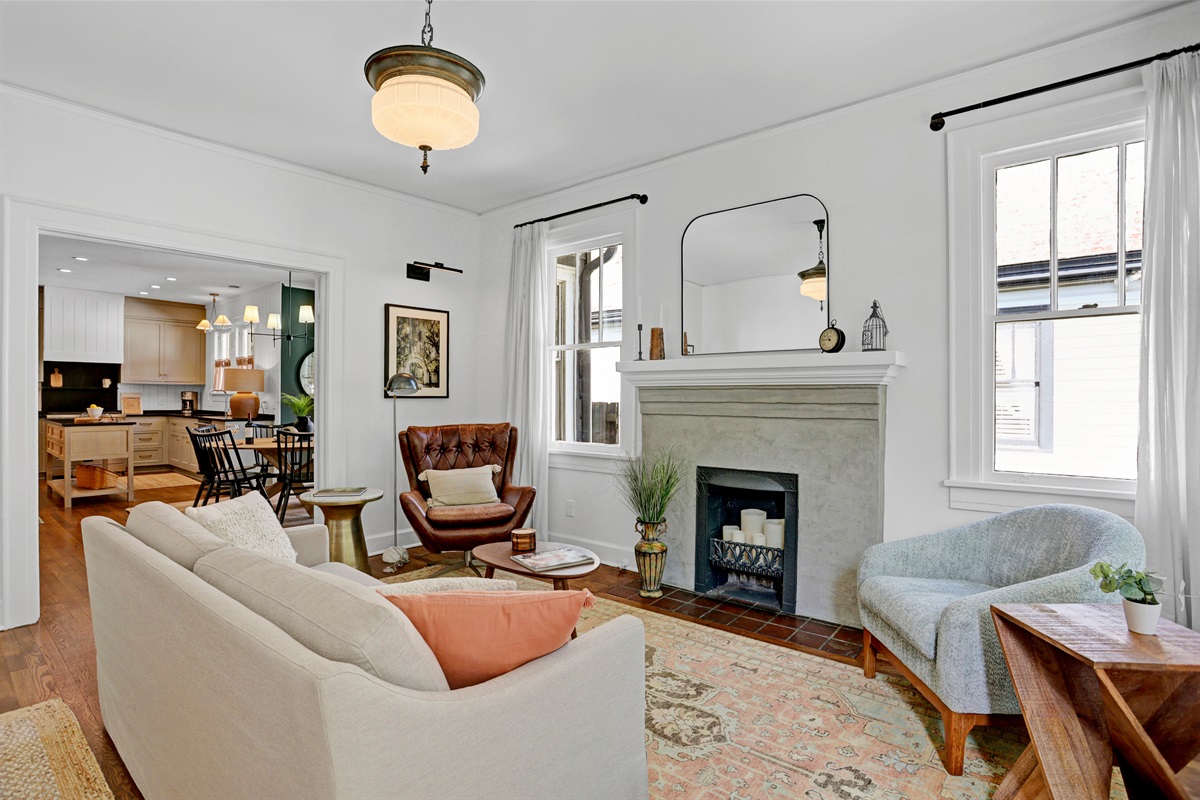 A decorative fireplace adds a touch of historic character and warmth.