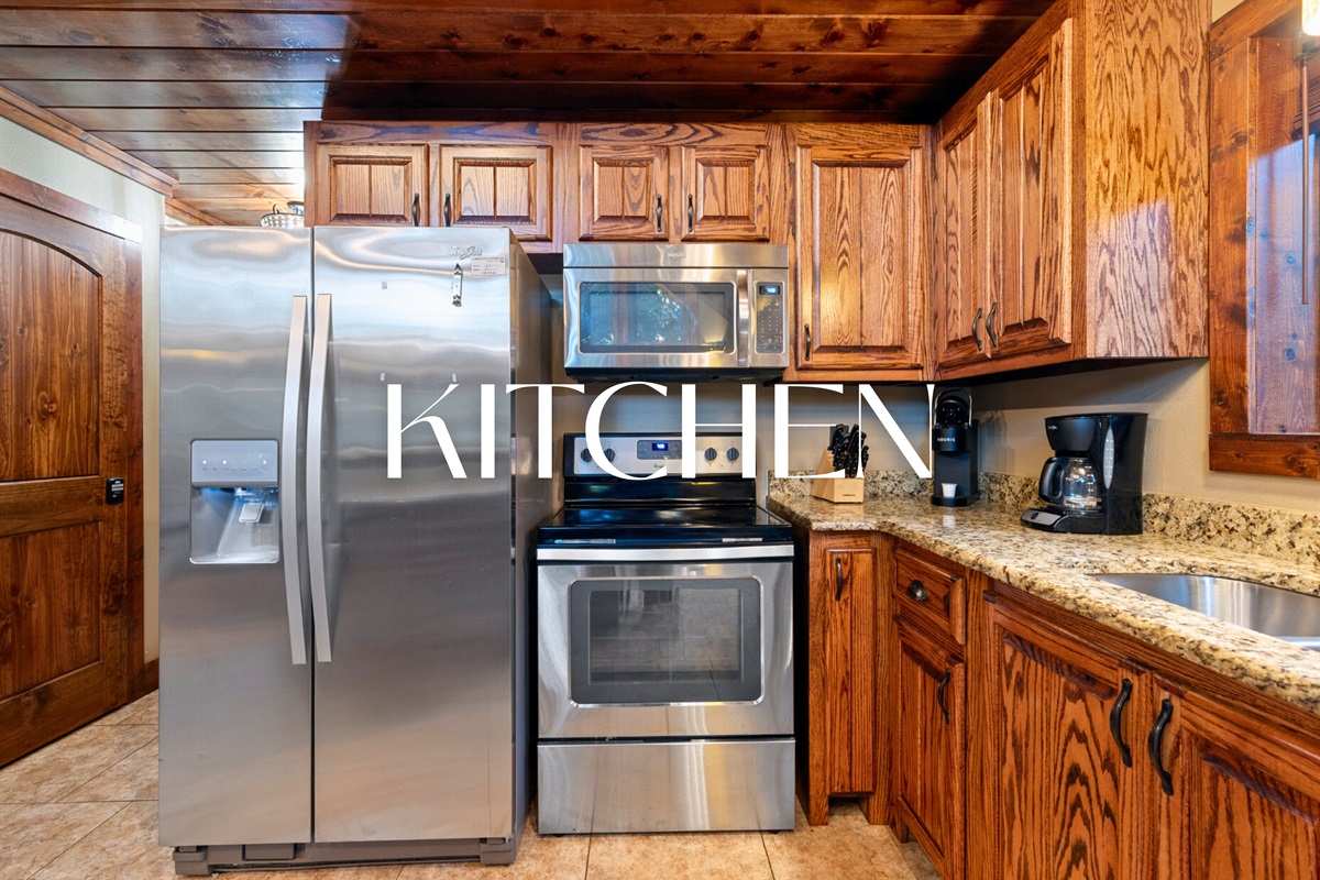 Fully stocked kitchen with stainless steel appliances for home-cooked feasts.