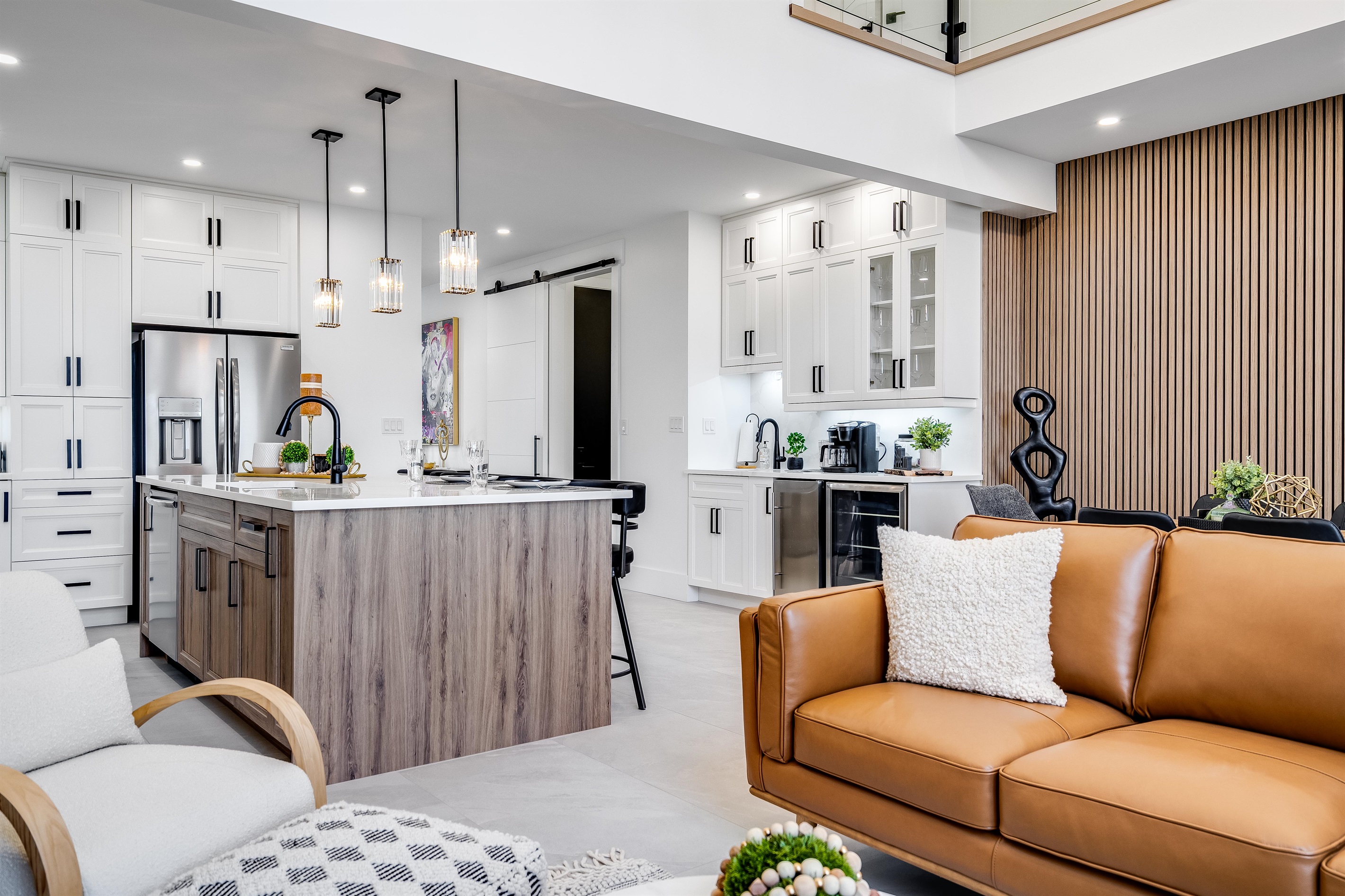 White backsplash tiles reflect light for an airy feel.