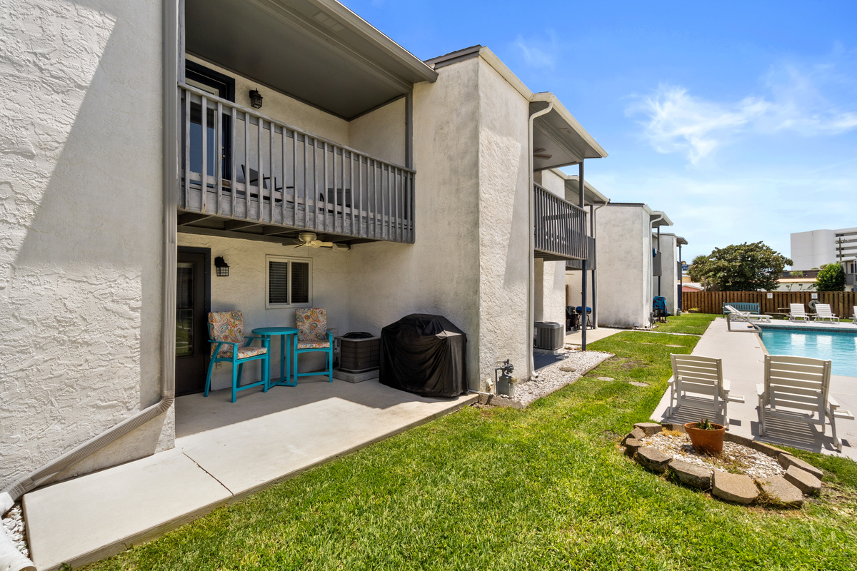 Patio off Living Room with Outdoor Seating, Grill, and Pool Access
