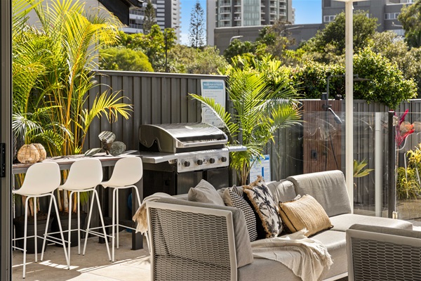 Outdoor BBQ area - perfect for relaxed waterfront dining and evening entertaining.