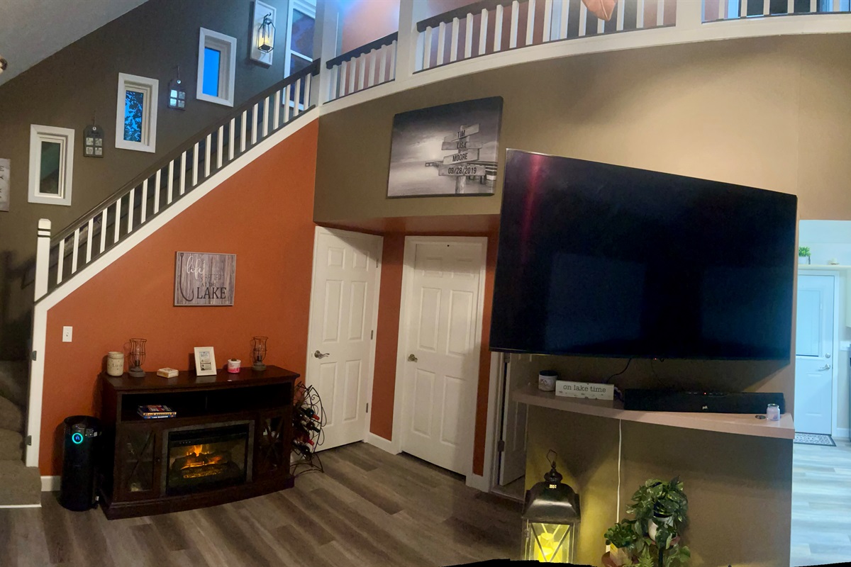 65" Smart TV and view of stairway 