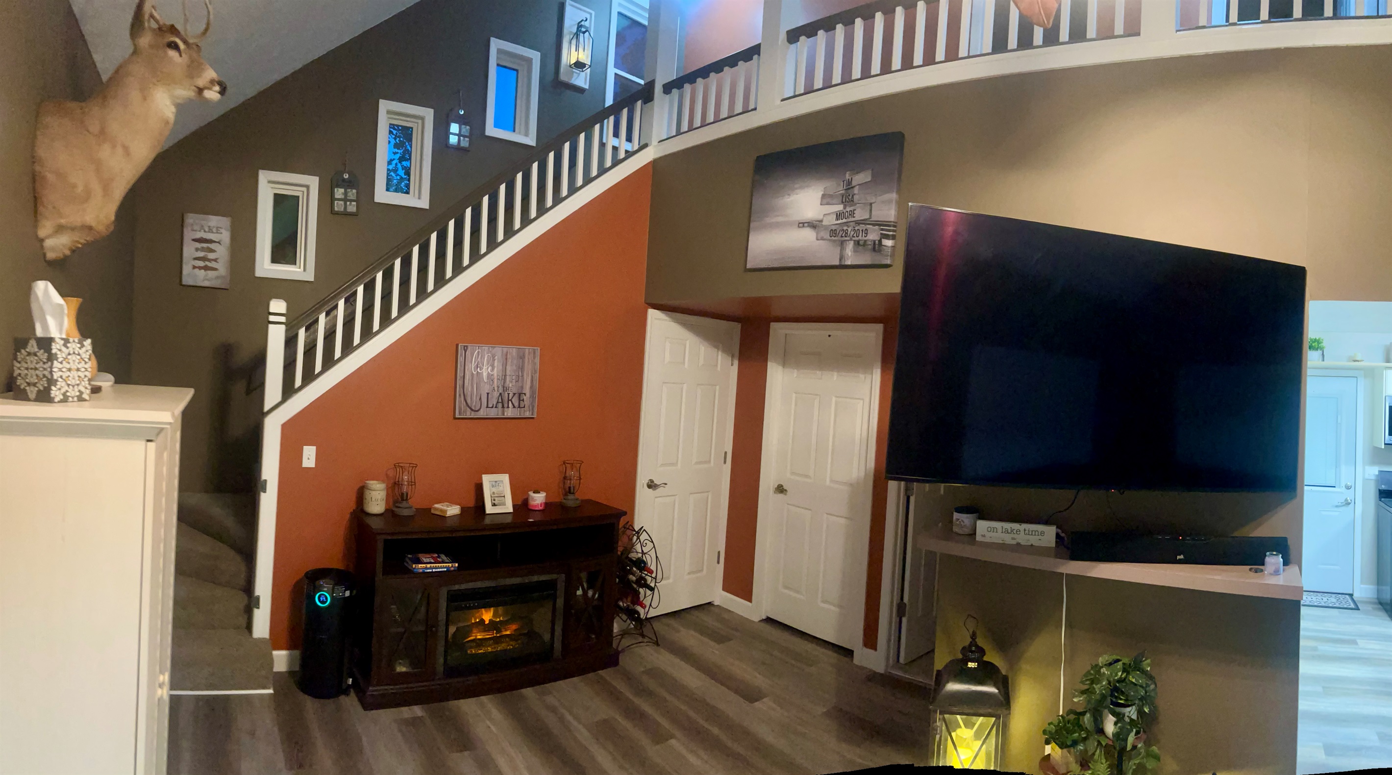 65" Smart TV and view of stairway 