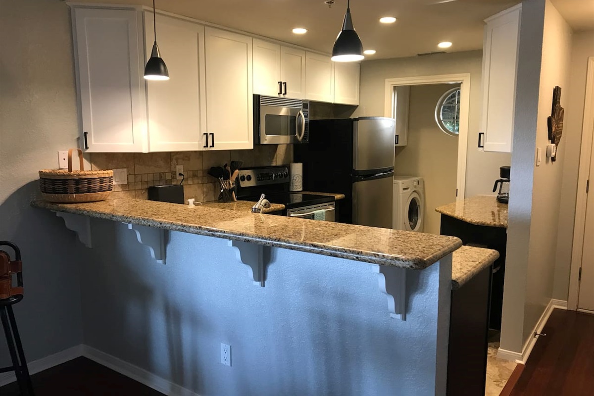 Fully Stocked Kitchen and adjacent Washer/Dryer