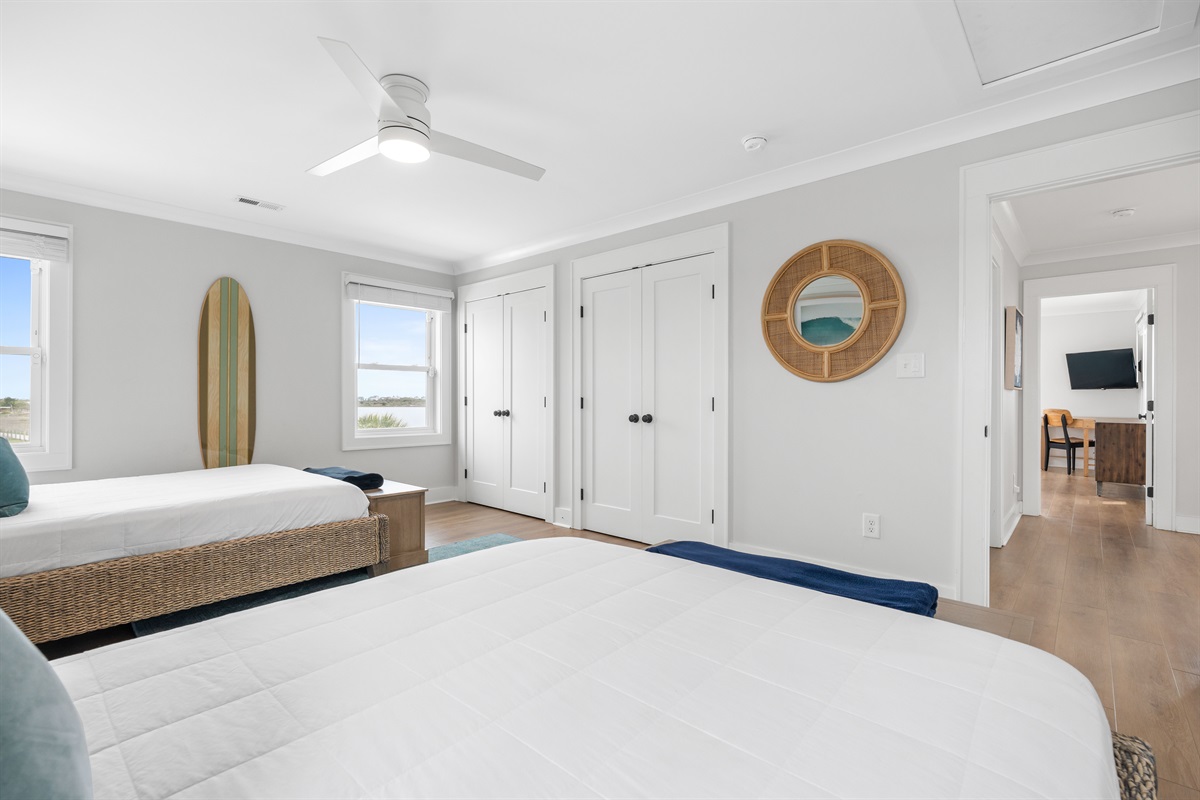 Spacious 2nd-floor private bedroom featuring two queen beds&mdash;perfect for families or groups traveling together