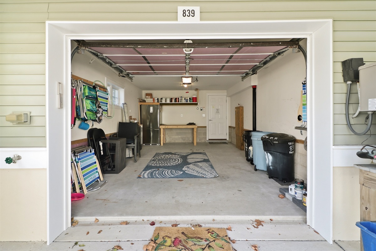 One-car garage including beach essentials and trash storage