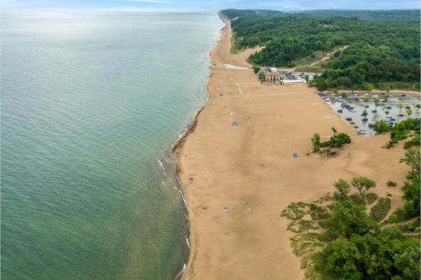 Indiana Dunes National Park lakeshore is located just 20 minutes away driving. Entry is $25 for a private vehicle. If you carry the America the Beautiful National Park Pass, admission is free. There are free beaches located along the Lake Shore.