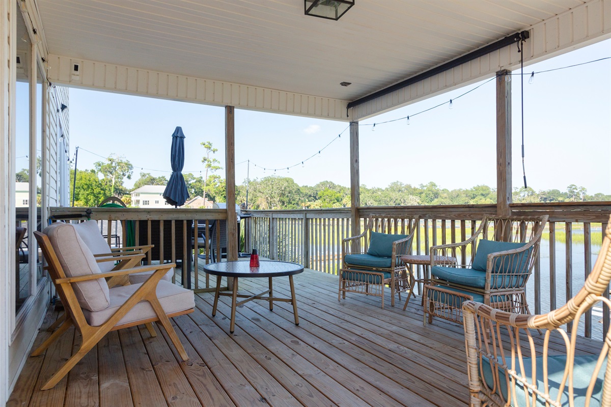Relax on the upper deck with comfortable seating and peaceful water views.