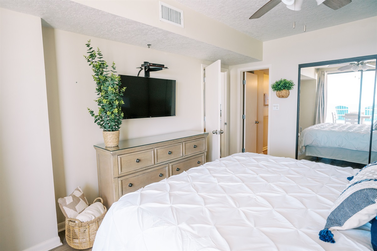 Master bedroom with ensuite Master Bath, upscale furniture, dresser, TV, lots of closet space.