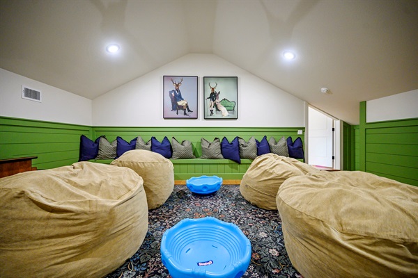 Bean bags, bold colors, and tons of space—this loft is where the laughs (and energy!) go wild. 🎉🦌