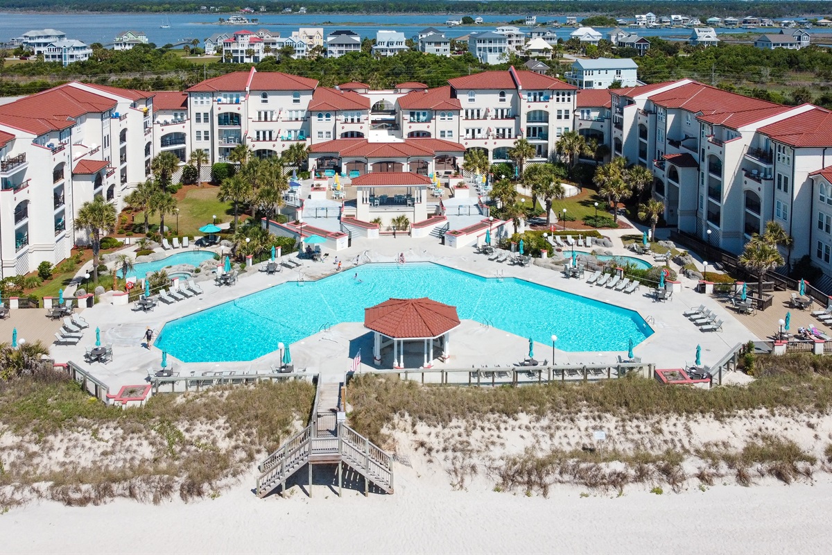 Coastal community stretches along a pristine beach