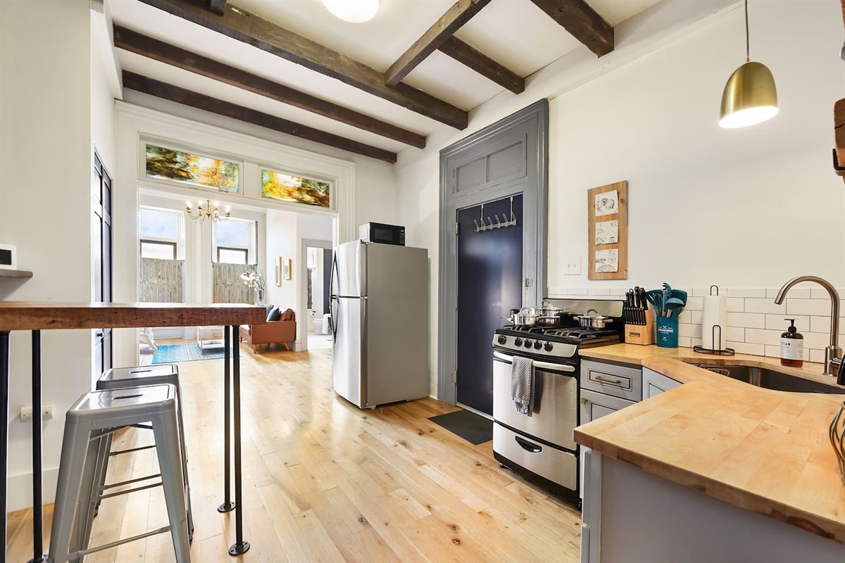 Fully equipped kitchen featuring modern design and sleek stainless steel appliances — ready for all your cooking needs.