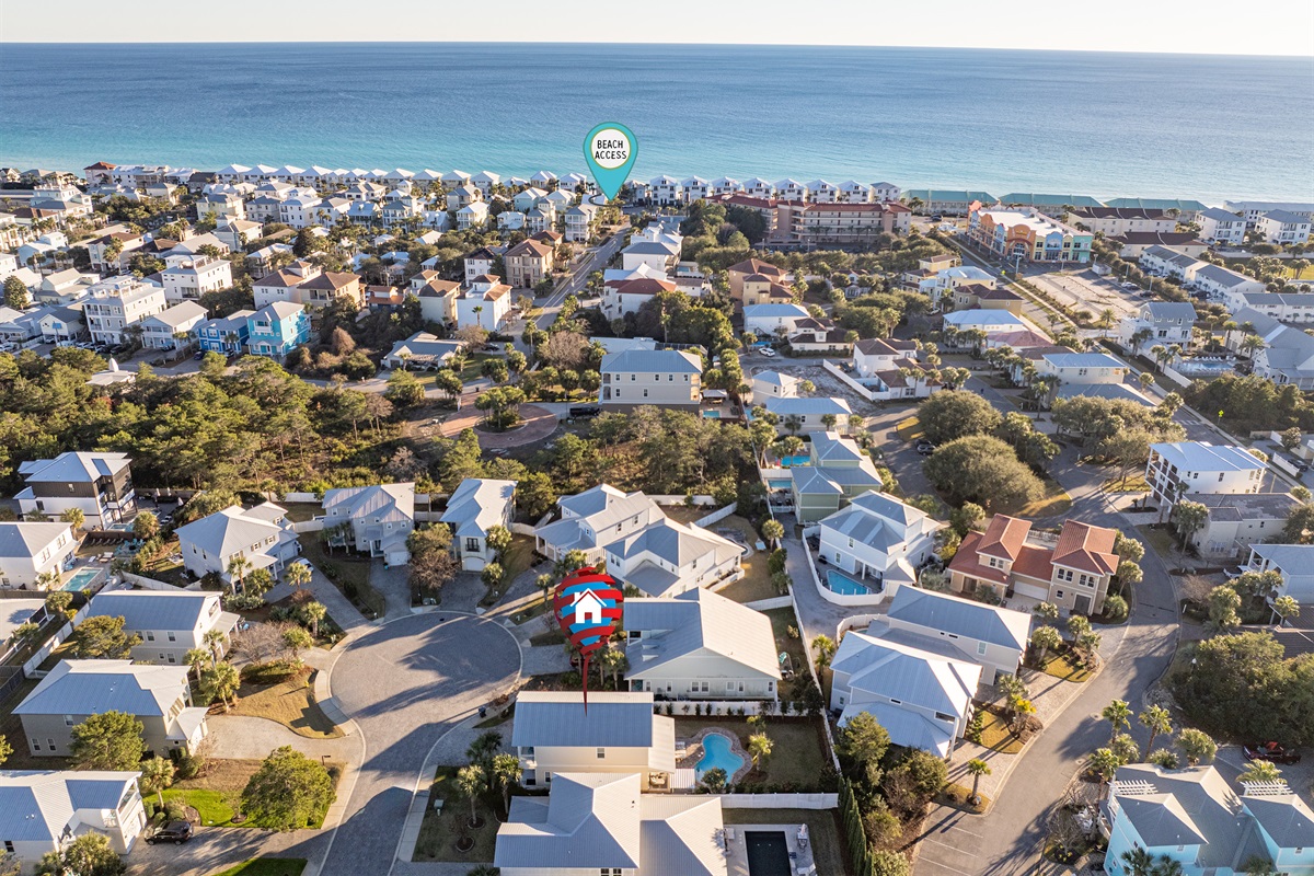Aerial overview of the neighborhood highlighting Aqua Reina and the nearby public beach access.