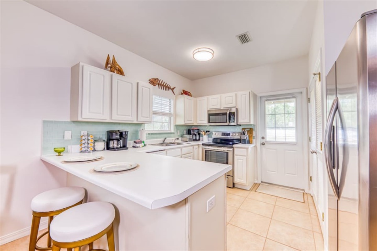 Kitchen: Bright and airy space with modern appliances, perfect for culinary adventures!