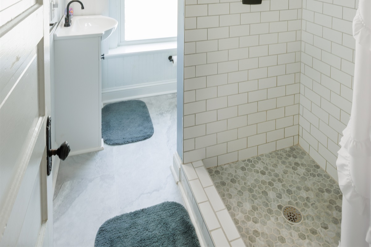 Peaceful and private space with modern fixtures. Full bathroom includes toilet, sink, and shower.