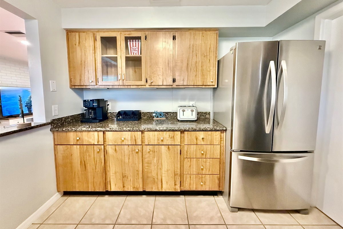 Brew your morning coffee and enjoy the sunrise with this serene window-side sink setup.