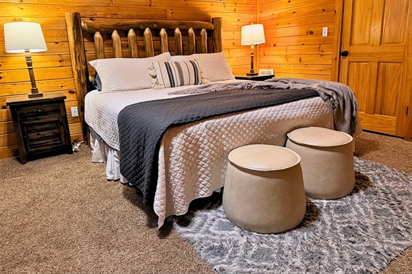 Another spacious downstairs bedroom featuring a king-size bed for your comfort!