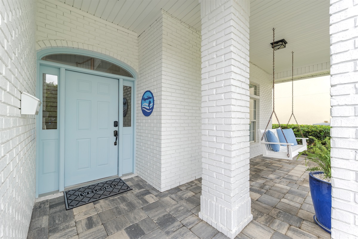 Welcome to Aqua Terra - your beach getaway begins the moment you walk through this cheerful blue door