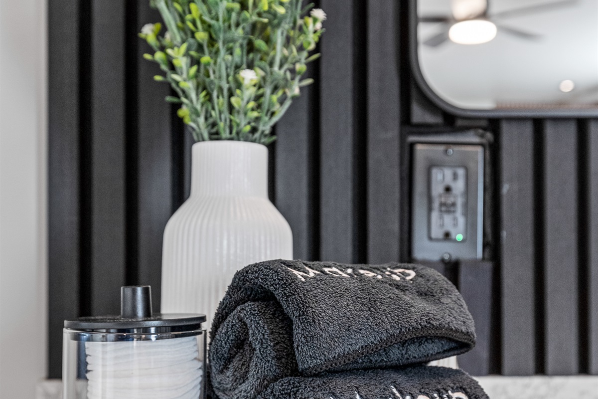 Guesthouse bathroom details featuring plush towels and curated décor touches.