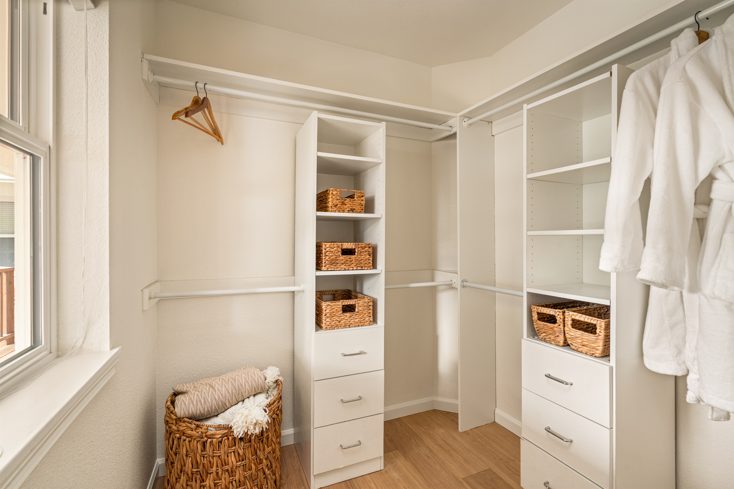 Primary suite walk in closet - perfect for longer stays! Spa robes provided.