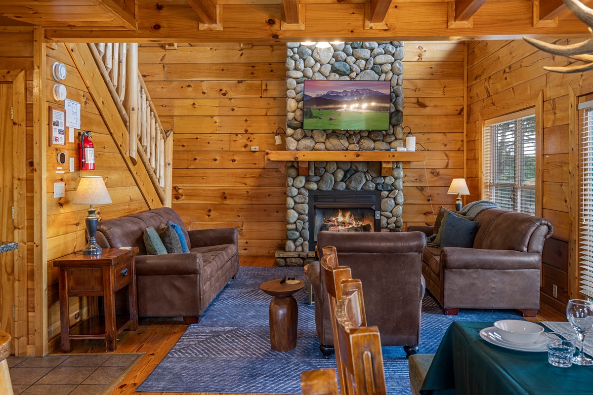 Curl up by the fireplace and enjoy the warm, inviting glow of the living area