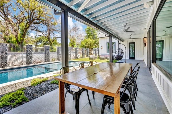 Enjoy the view poolside in the shade of a covered veranda.