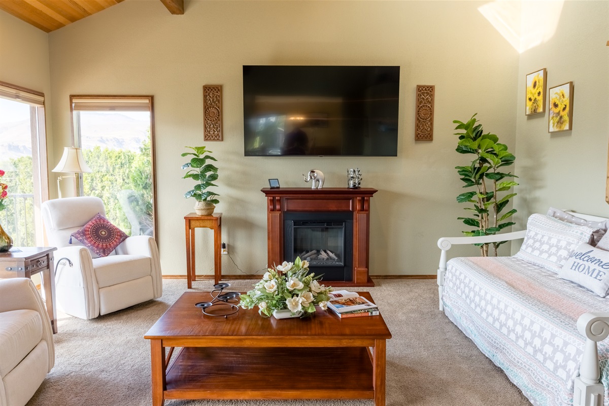 Comfortable gathering space with large windows and natural light.