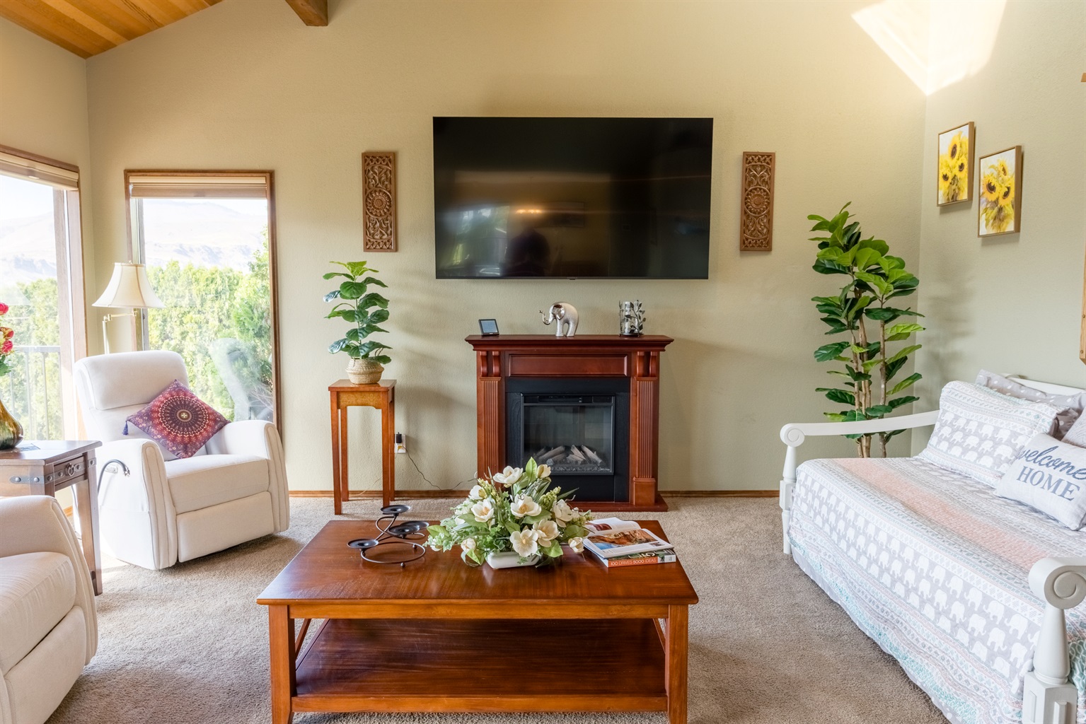 Comfortable gathering space with large windows and natural light.