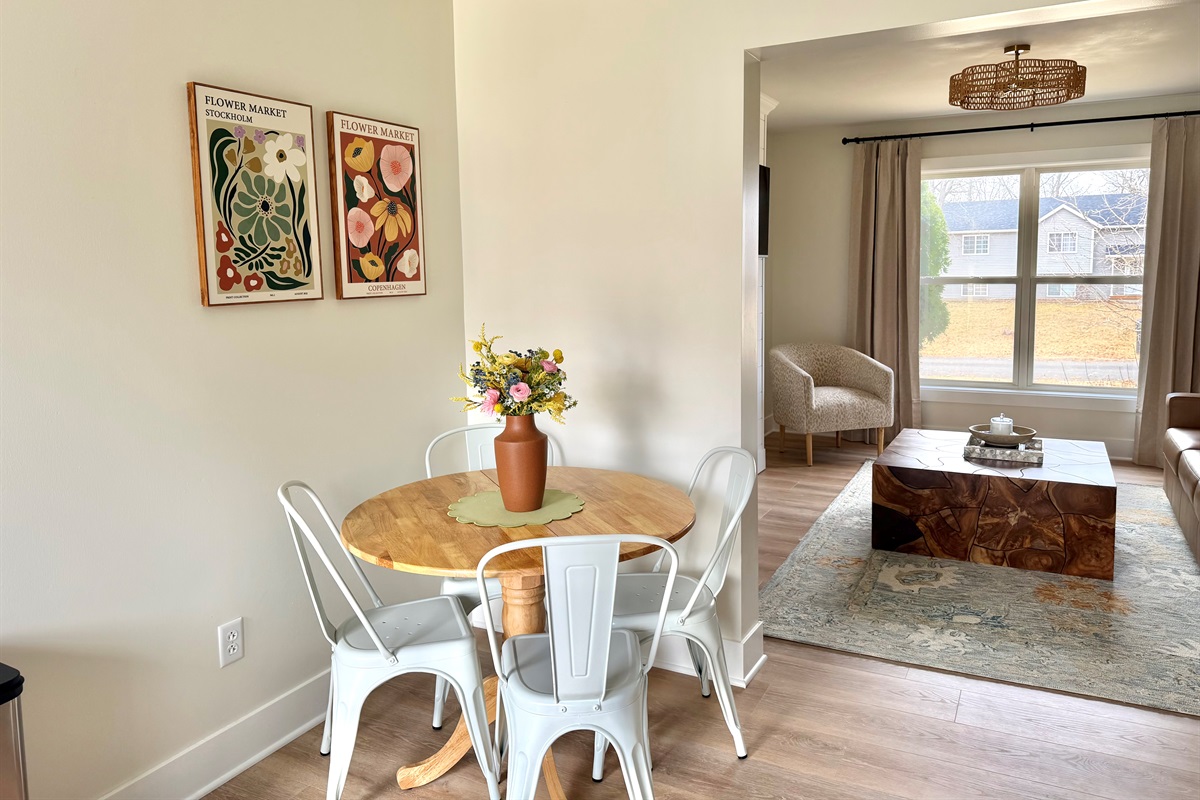 Cozy dining area with seating for four, perfect for shared meals, morning coffee, or planning the day ahead.