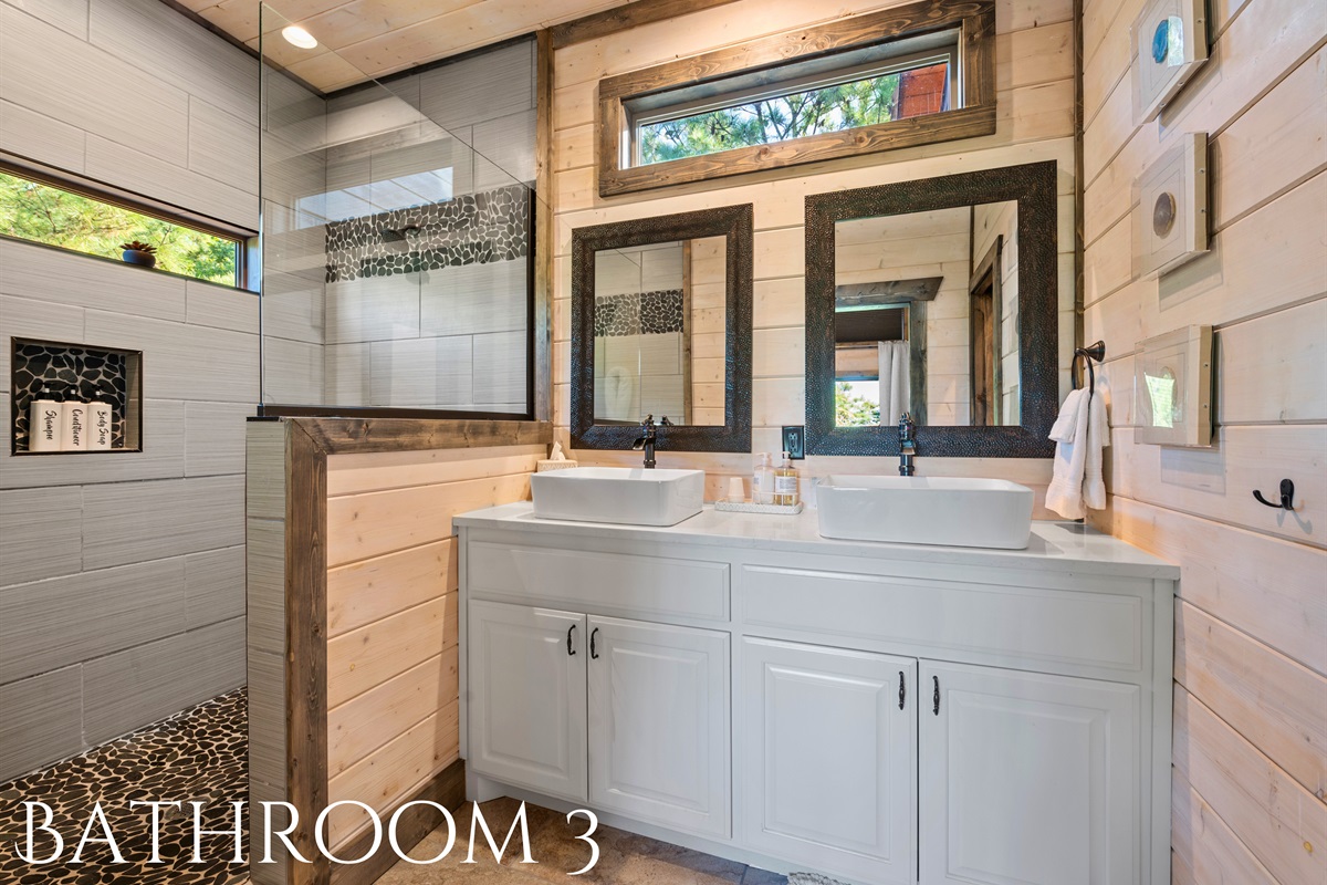 The modern bathroom offers sleek finishes and a spacious layout, perfect for getting ready or winding down.
