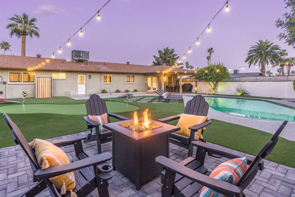 A gas fire pit is just one of the amenities you'll find in this resort-style back yard.