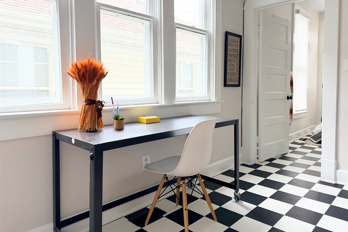 Light-filled dedicated workspace in a convenient location, easily repositioned to adjoining room for added privacy. 