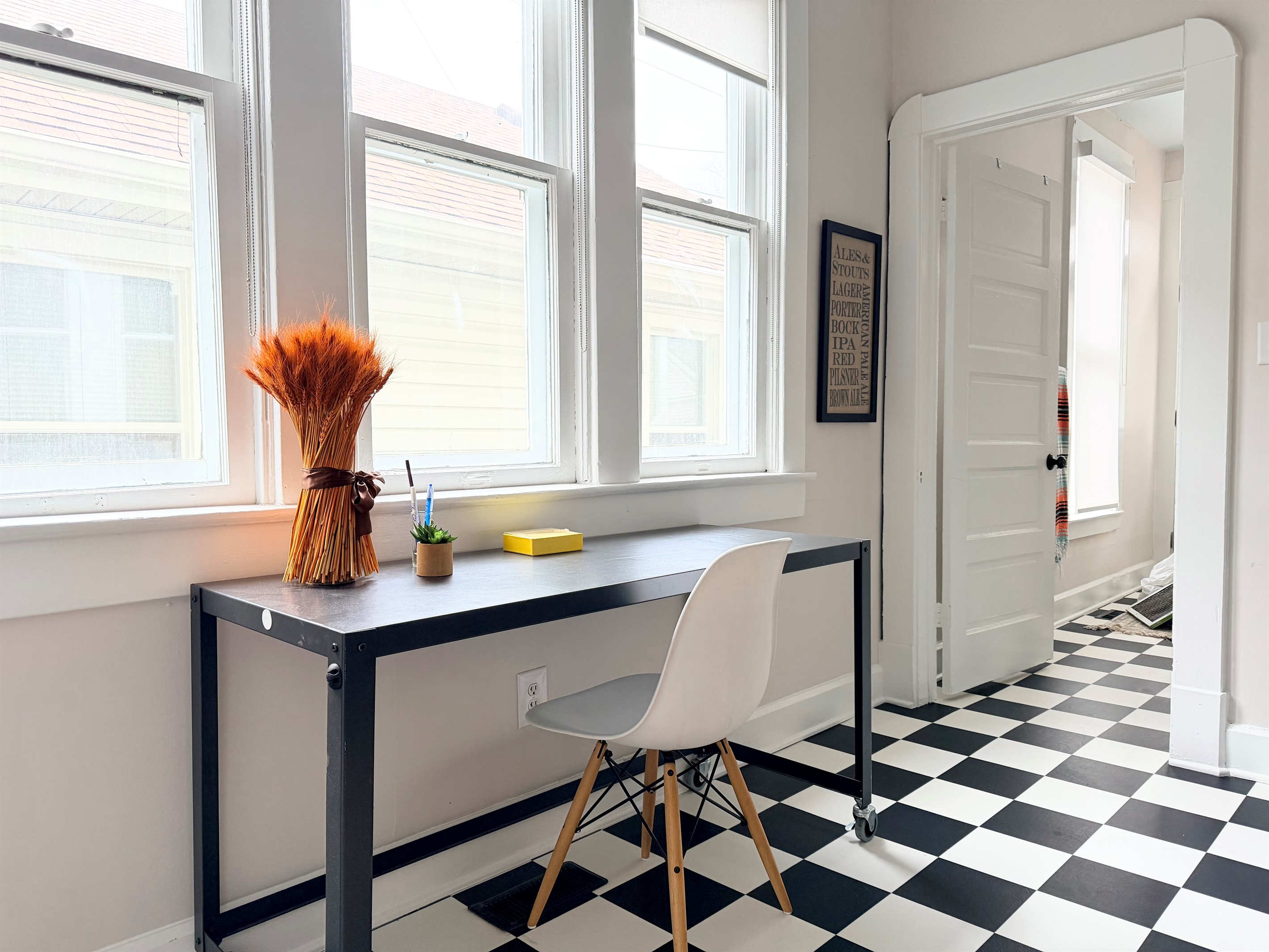 Light-filled dedicated workspace in a convenient location, easily repositioned to adjoining room for added privacy. 