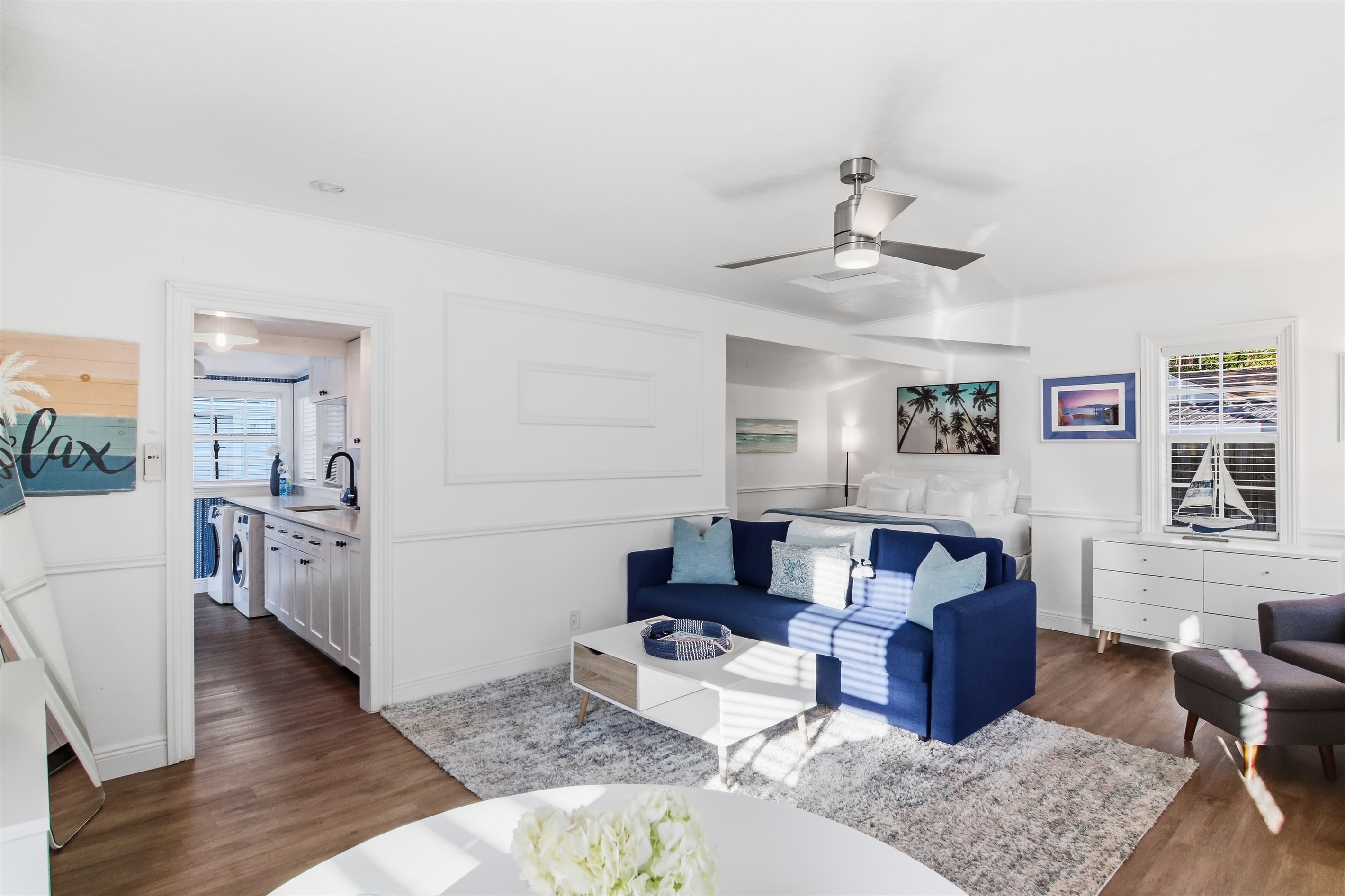 The Paradise Pool Cottage House offers a living room area, well stocked kitchen, workspace, a sleeping area with king bed, and a full bath.