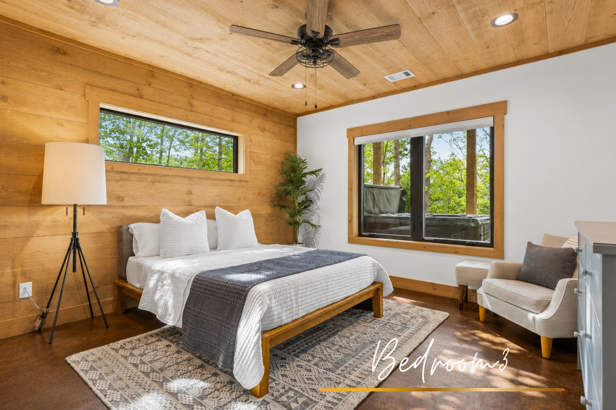 A sky-hued escape surrounded by nature. This queen bedroom is as dreamy as it gets.