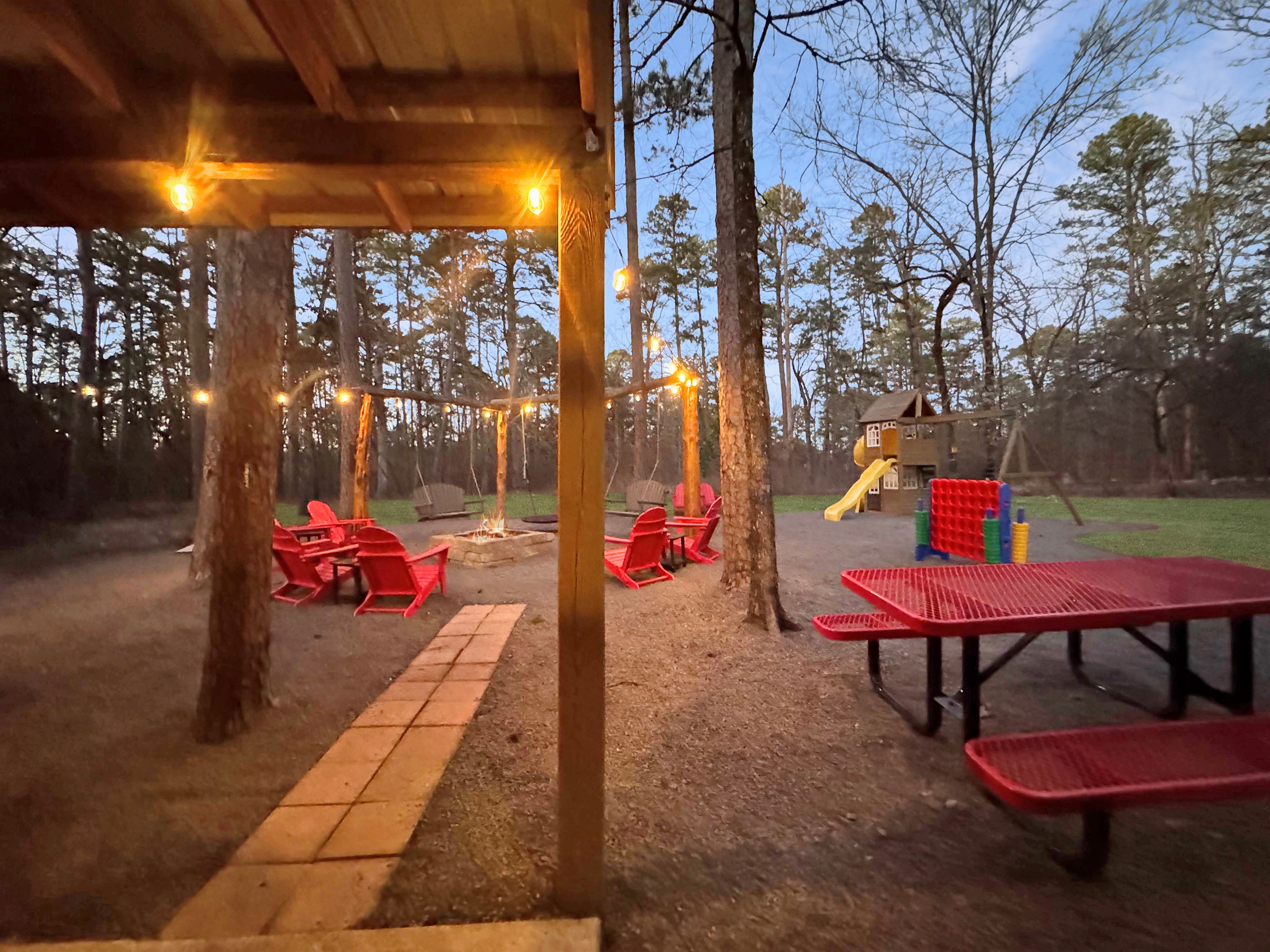 Magic happens when the bistro lights glow - your enchanted forest retreat awaits.