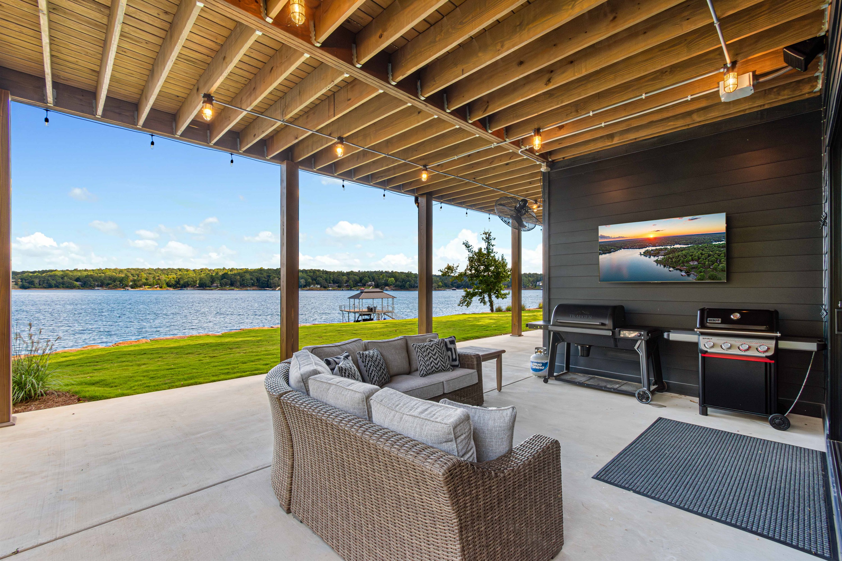 Outdoor gas grill, electric smoker and entertaining area.